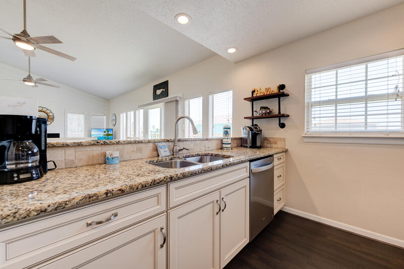 Kitchen with granite counters and coffee maker