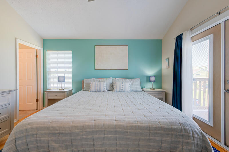 King bedroom with deck door